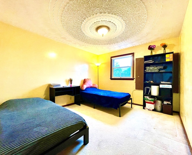 carpeted bedroom featuring a textured ceiling