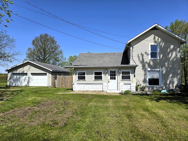 752 State Route 101, Clyde, OH 43410 - view of front of house featuring a garage and roof with shingles