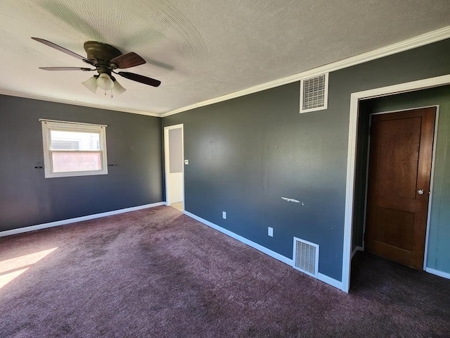 carpeted spare room with ceiling fan, a textured ceiling, and ornamental molding