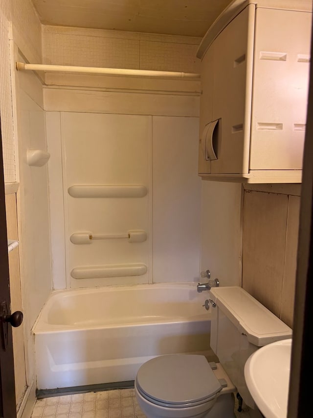 full bath with toilet, bathtub / shower combination, and a sink