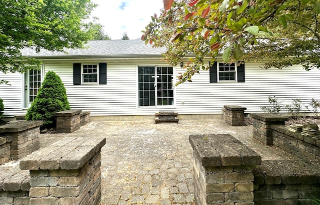 back of house with a patio