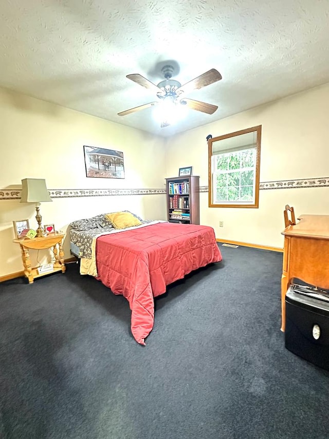 bedroom featuring carpet, a textured ceiling, and ceiling fan