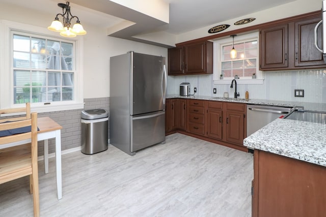 431 Overlook Rd, Mansfield, OH 44903 - kitchen featuring appliances with stainless steel finishes, light wood finished floors, plenty of natural light, wainscoting, and tile walls