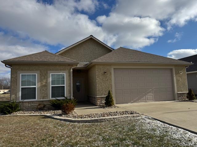 view of front of property with a garage