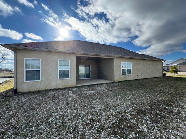 back of house with a patio