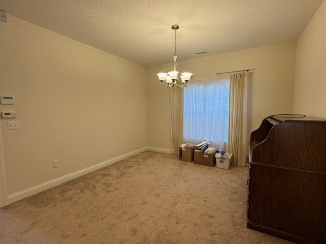 interior space with light colored carpet and a notable chandelier