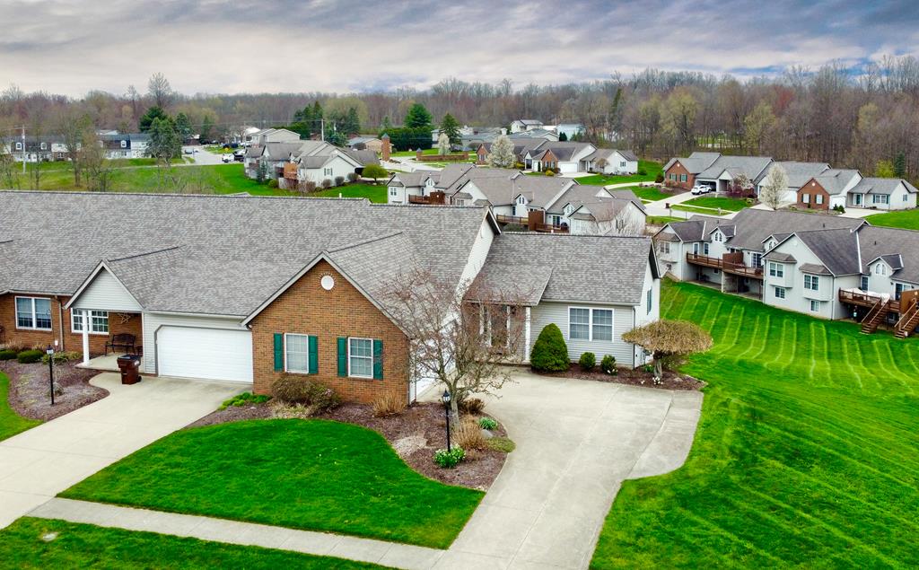 1604 Nantucket Dr, Mansfield, OH 44904 - single story home with concrete driveway, an attached garage, brick siding, and a residential view