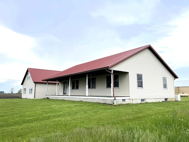 4030 Shoup Rd, Shelby, OH 44875 - back of property with a yard, metal roof, and a porch