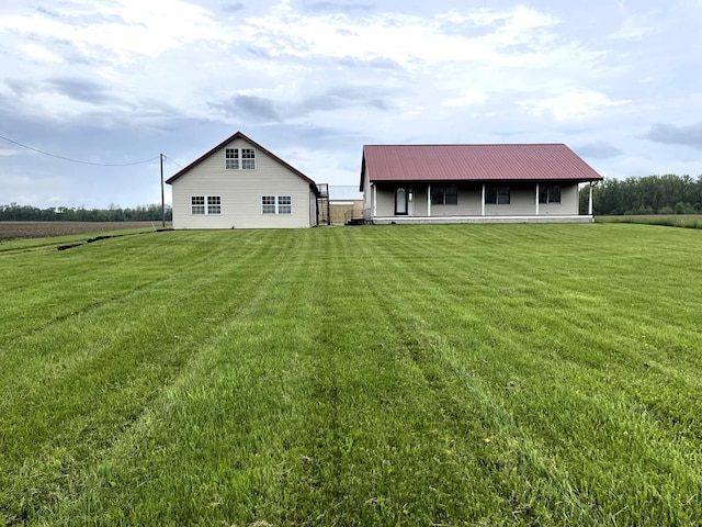 4030 Shoup Rd, Shelby, OH 44875 - rear view of property with a lawn and metal roof