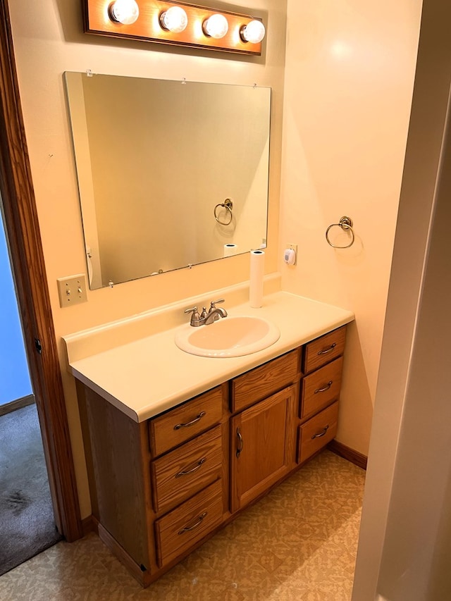 4030 Shoup Rd, Shelby, OH 44875 - bathroom featuring vanity, tile patterned floors, and baseboards