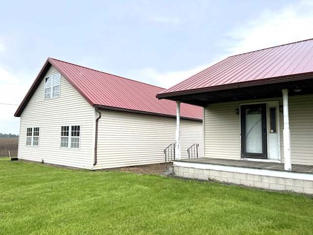 4030 Shoup Rd, Shelby, OH 44875 - back of property with covered porch, a yard, and metal roof