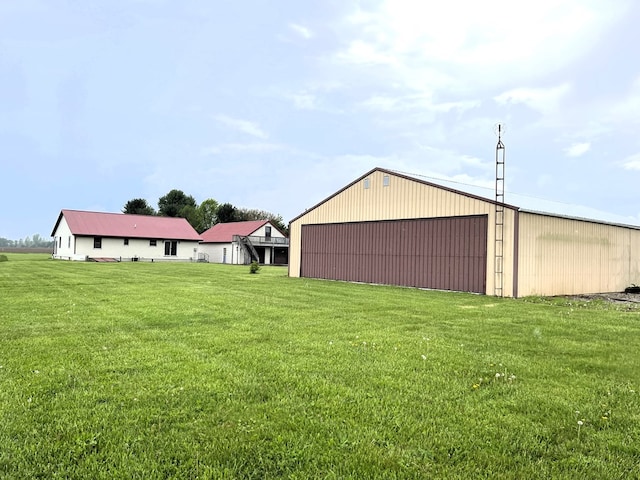 4030 Shoup Rd, Shelby, OH 44875 - view of grassy yard with a pole building, a garage, and an outdoor structure
