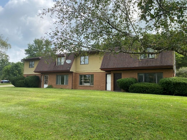 view of front of home with a front yard