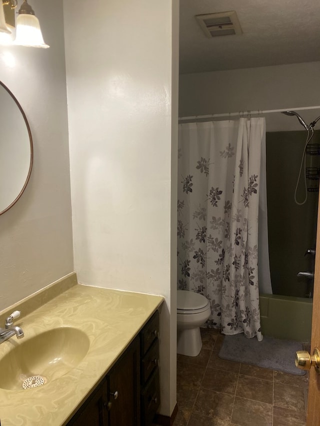 full bathroom with toilet, vanity, and shower / tub combo