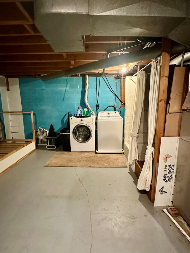 basement with washing machine and clothes dryer