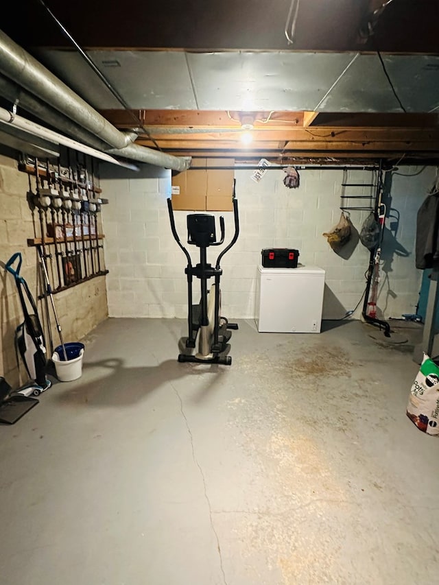 basement featuring fridge