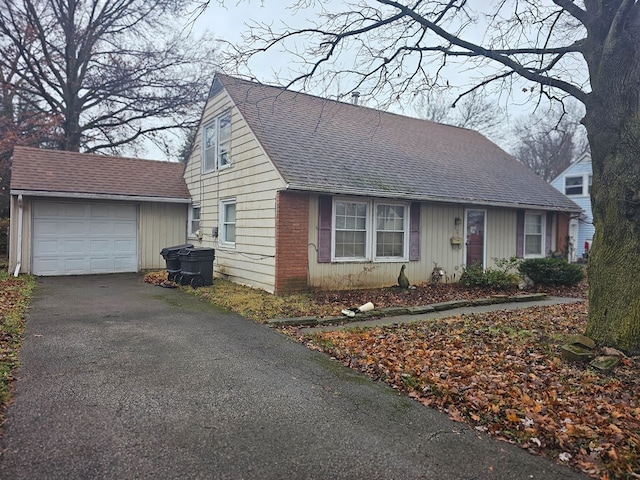 view of front of home featuring an outbuilding and a garage