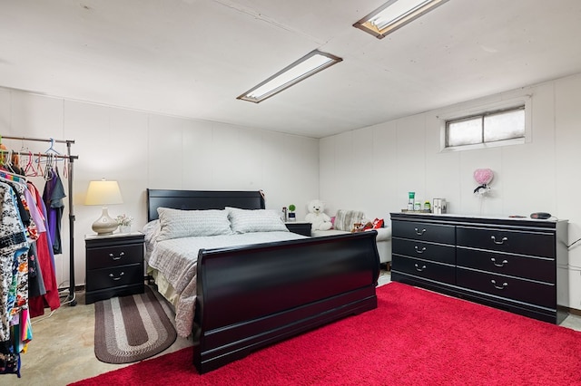 bedroom featuring concrete floors