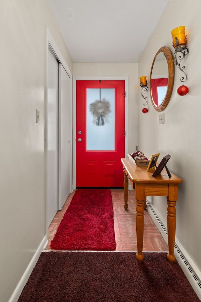 doorway to outside with baseboard heating