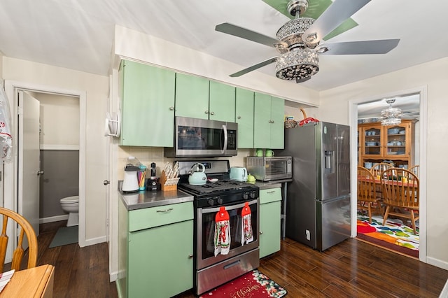 kitchen featuring tasteful backsplash, green cabinets, stainless steel appliances, and dark hardwood / wood-style floors