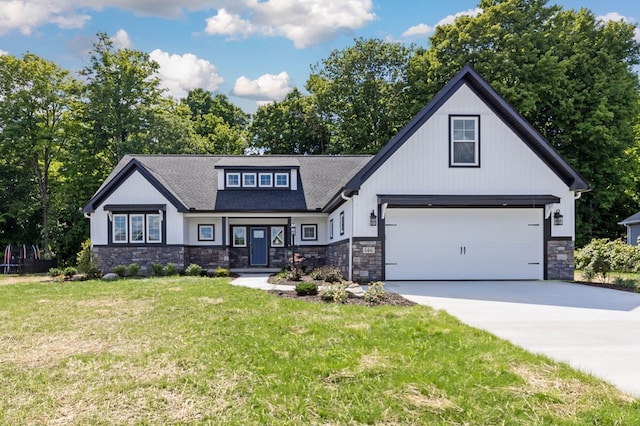 view of front of house featuring a garage and a front lawn