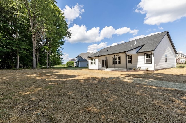 back of house with a patio