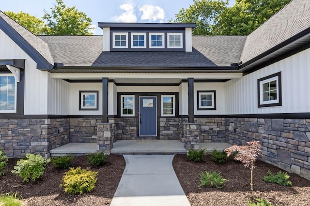 property entrance featuring covered porch