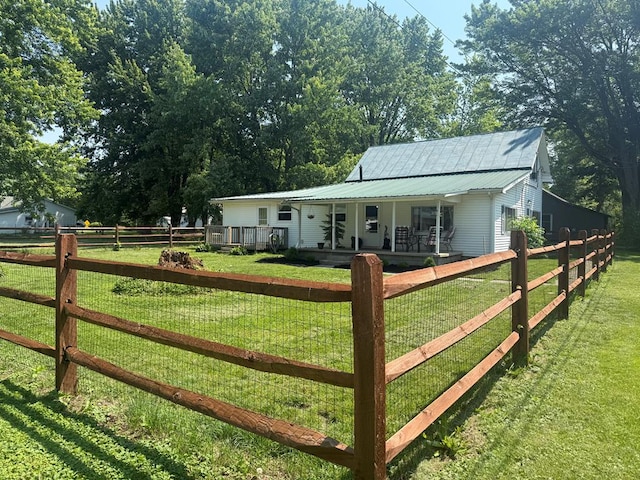 247 3rd St, Larue, OH 43332 - view of front of house with a porch, a metal roof, and a fenced front yard