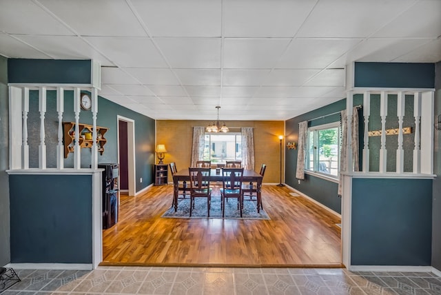 247 3rd St, Larue, OH 43332 - dining room featuring a chandelier, healthy amount of natural light, a drop ceiling, and wood finished floors