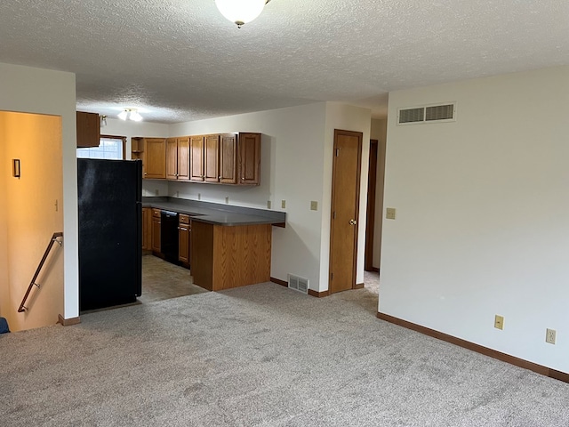 kitchen with kitchen peninsula, a textured ceiling, light carpet, and black appliances