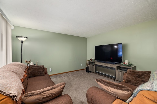 carpeted living room featuring a textured ceiling