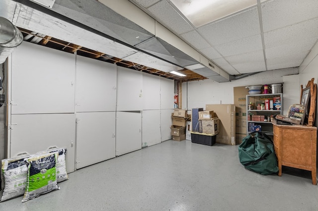 basement featuring a paneled ceiling