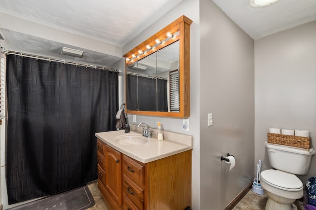 bathroom with vanity, curtained shower, and toilet