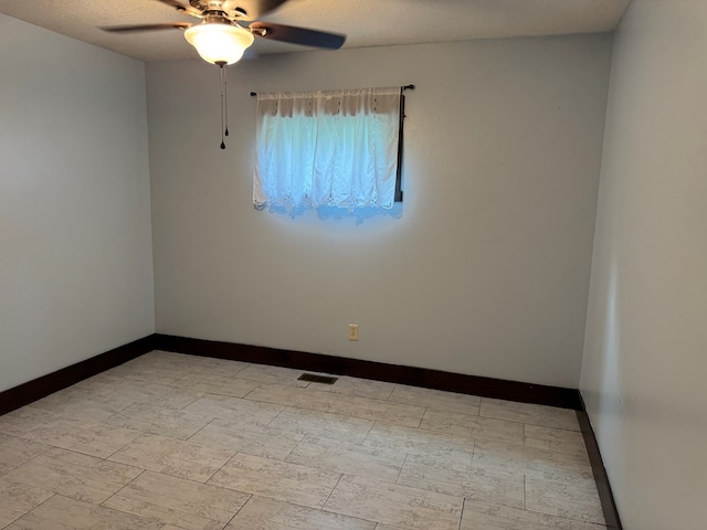 227 S Jefferson St, Loudonville, OH 44842 - spare room featuring a ceiling fan and a textured ceiling