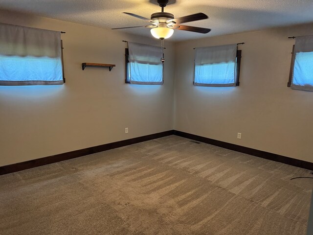 227 S Jefferson St, Loudonville, OH 44842 - unfurnished room featuring a ceiling fan, carpet floors, and a textured ceiling