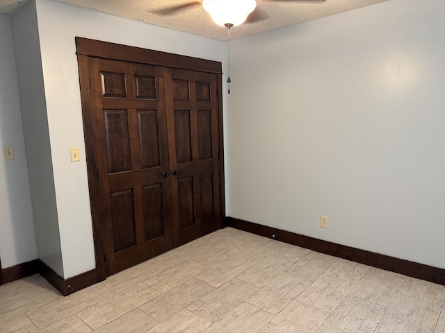 227 S Jefferson St, Loudonville, OH 44842 - unfurnished bedroom featuring light wood-style floors and ceiling fan