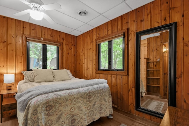 58 Edgewood Dr, Perrysville, OH 44864 - bedroom with wooden walls and wood finished floors