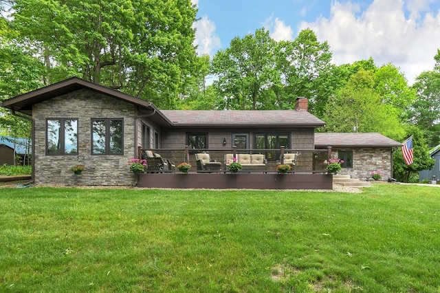 58 Edgewood Dr, Perrysville, OH 44864 - rear view of house featuring stone siding, a chimney, and a yard