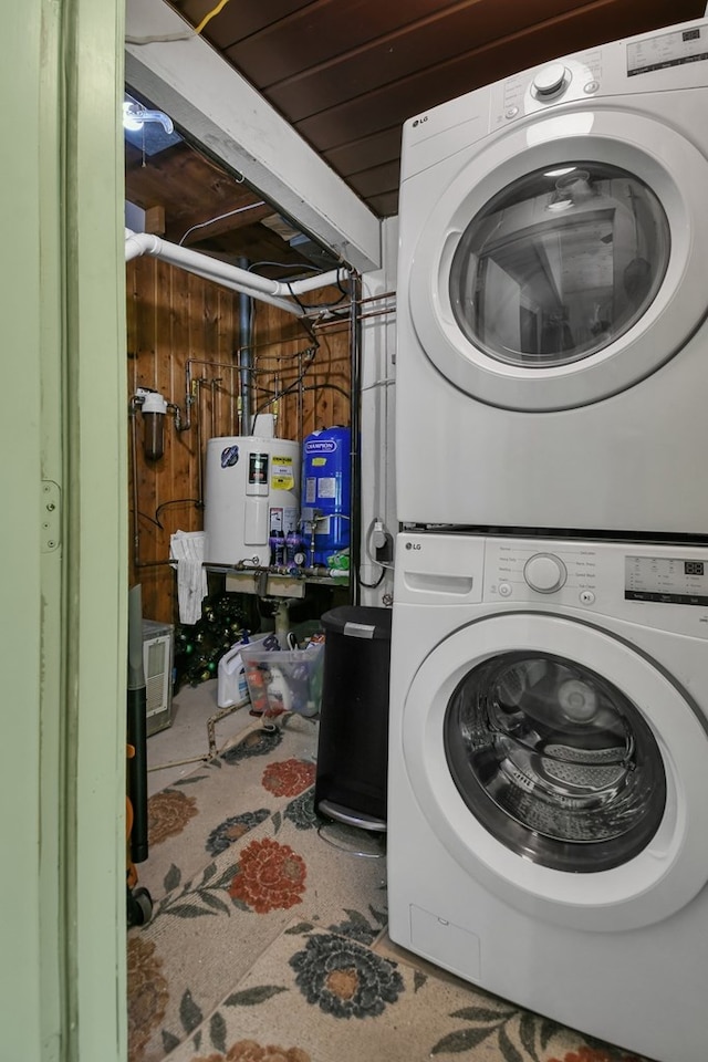 58 Edgewood Dr, Perrysville, OH 44864 - laundry area with estacked washer and dryer and electric water heater