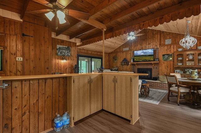 58 Edgewood Dr, Perrysville, OH 44864 - kitchen featuring wooden walls, wooden ceiling, ceiling fan, wood finished floors, and open floor plan