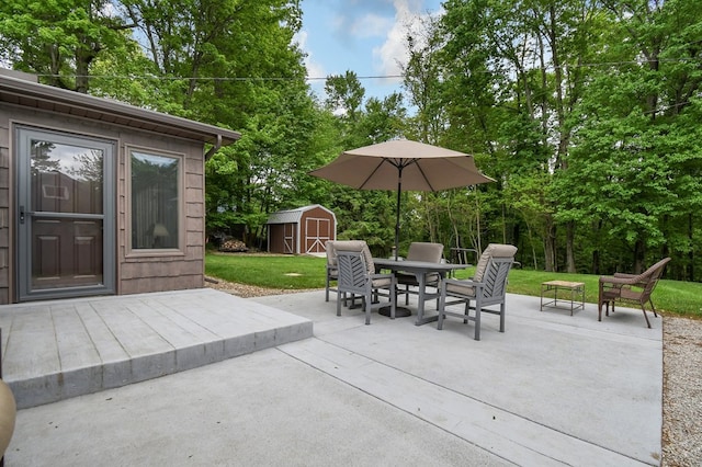 58 Edgewood Dr, Perrysville, OH 44864 - view of patio / terrace with outdoor dining space and view of scattered trees