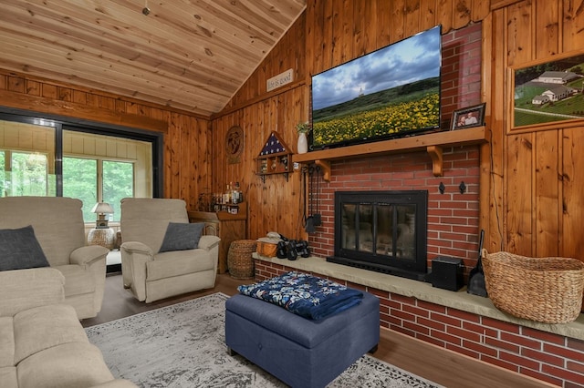 58 Edgewood Dr, Perrysville, OH 44864 - living room with vaulted ceiling, wood walls, wood finished floors, a fireplace, and wooden ceiling