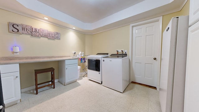 washroom with cabinet space, washing machine and dryer, light floors, and recessed lighting