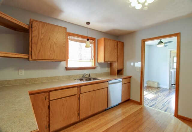 821 Charles St, Galion, OH 44833 - kitchen with dishwasher, a sink, open shelves, light wood-style flooring, and light countertops