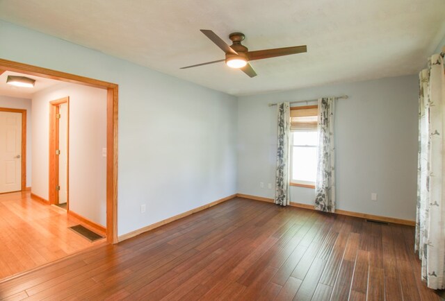 821 Charles St, Galion, OH 44833 - empty room featuring a ceiling fan, baseboards, and hardwood / wood-style flooring