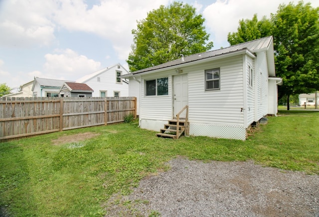 821 Charles St, Galion, OH 44833 - rear view of property featuring entry steps and metal roof