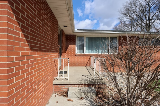 view of property exterior featuring brick siding