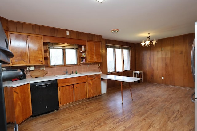 kitchen featuring a sink, brown cabinets, dishwasher, and open shelves