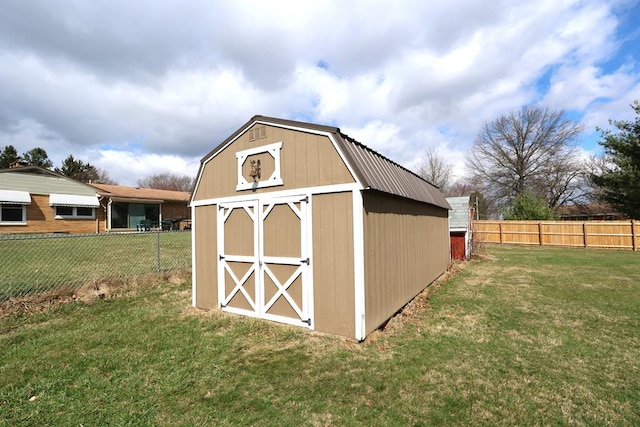 view of shed with a fenced backyard