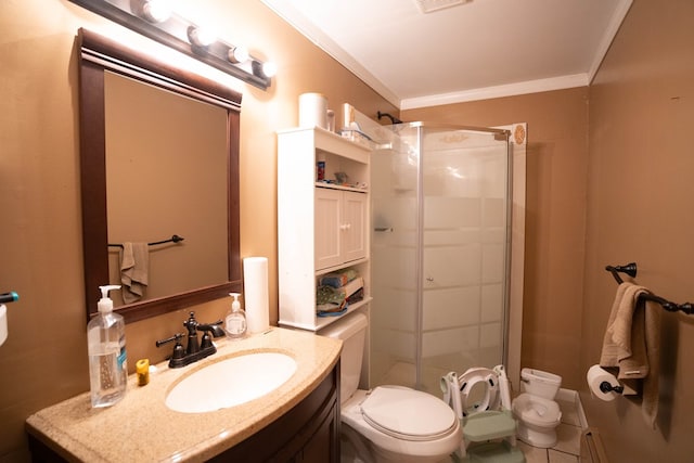 full bathroom featuring crown molding, tile patterned floors, a stall shower, vanity, and toilet
